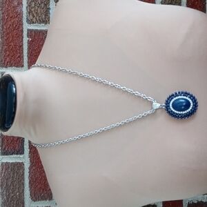 Beautiful navy blue center with faux diamond accents beautiful piece